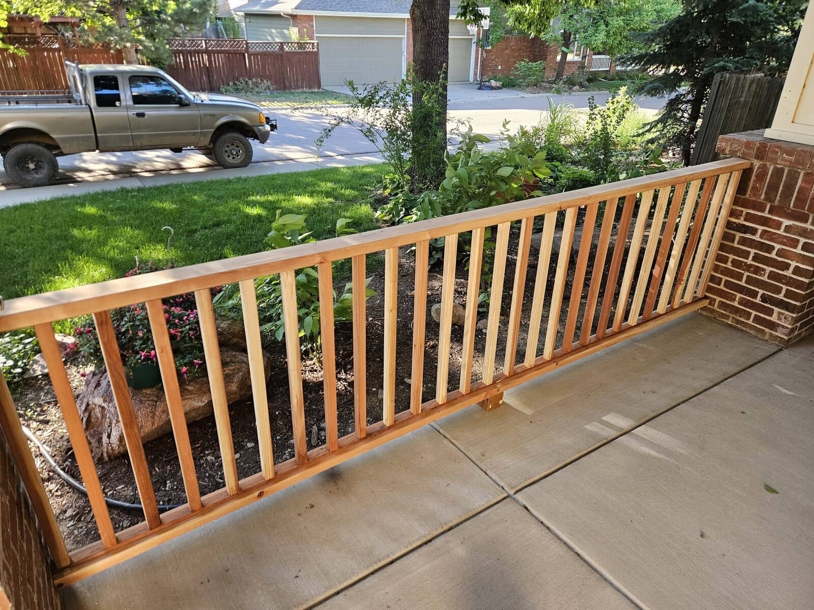 Wooden deck railing on concrete