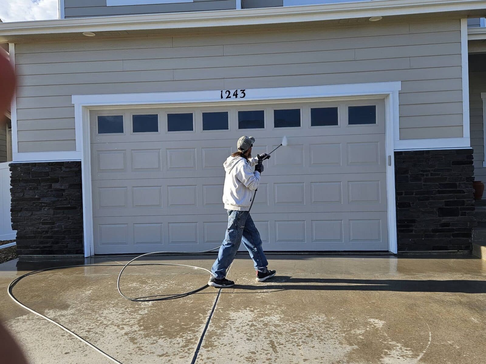 Power washing a driveway