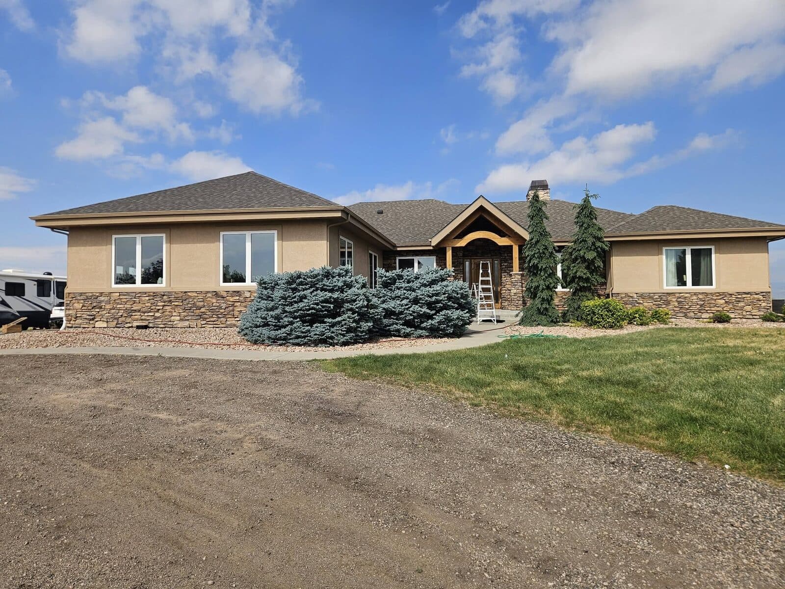Ranch home with stone and stucco exterior